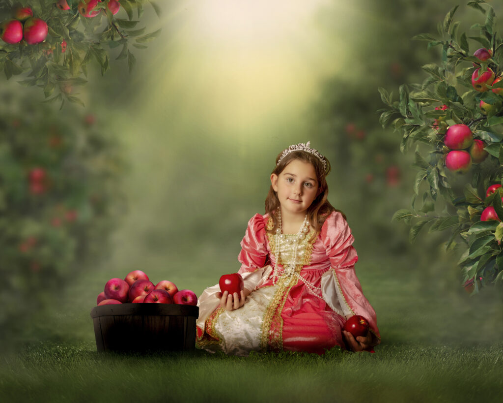 Photoshopped green grass and red apples for a magical shoot