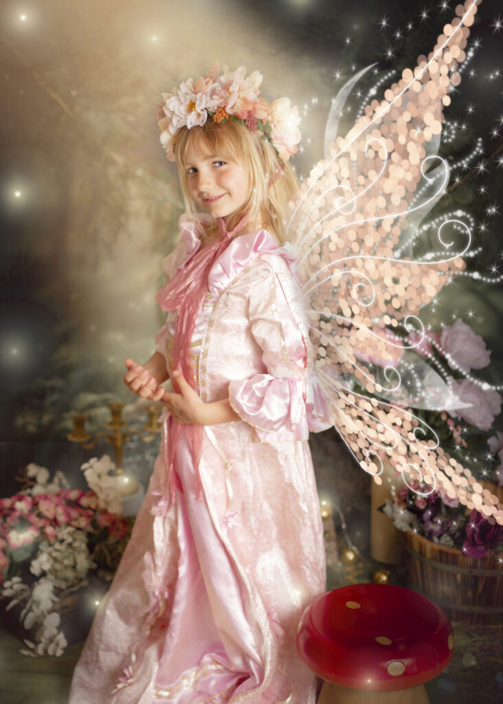 Magical fairytale photo of girl with pink wings