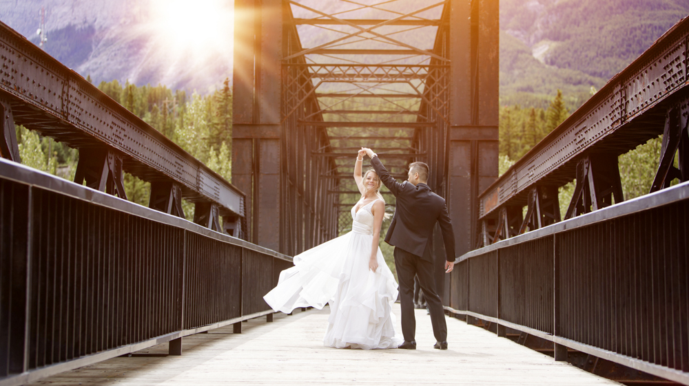 Beautiful creative photo of couple at engine bridge, canmore