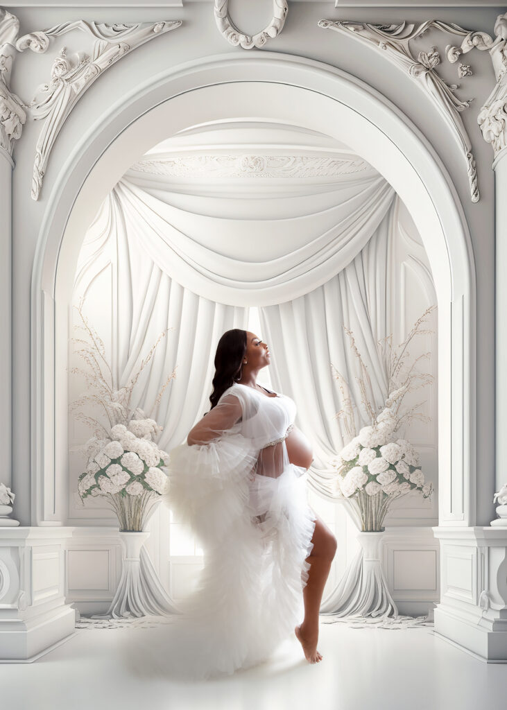 Elegant maternity photoshoot in a modern white room.