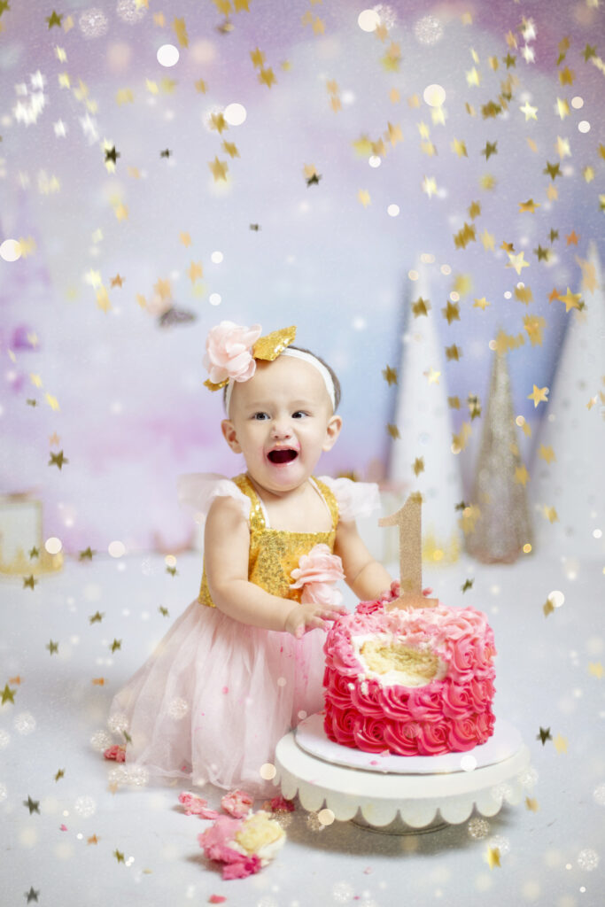 Calgary cake smash photographer baby girl first birthday pink cake smash session
