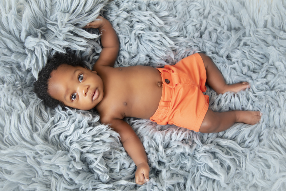Happy baby boy in a professional photoshoot